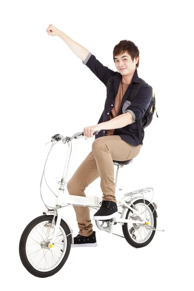 快乐亚洲年轻人骑着自行车在白色背景上孤立 — 图库照片