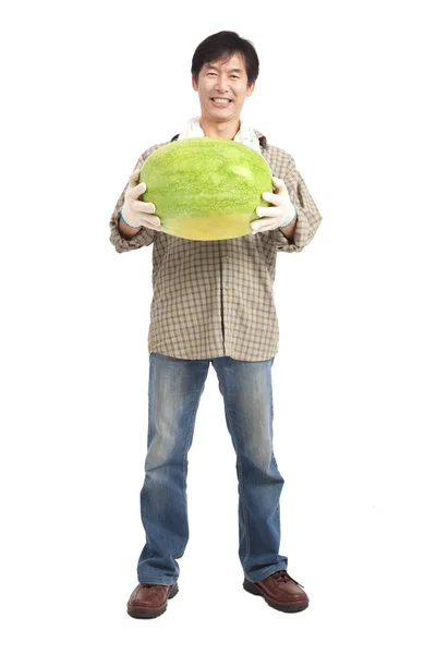 Happy asian farmer holding watermelon full length — Stock Photo, Image