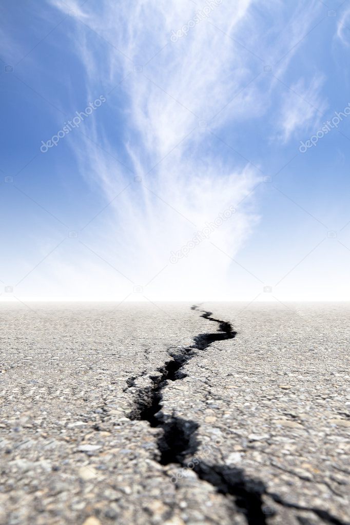 Cracked road with cloud background