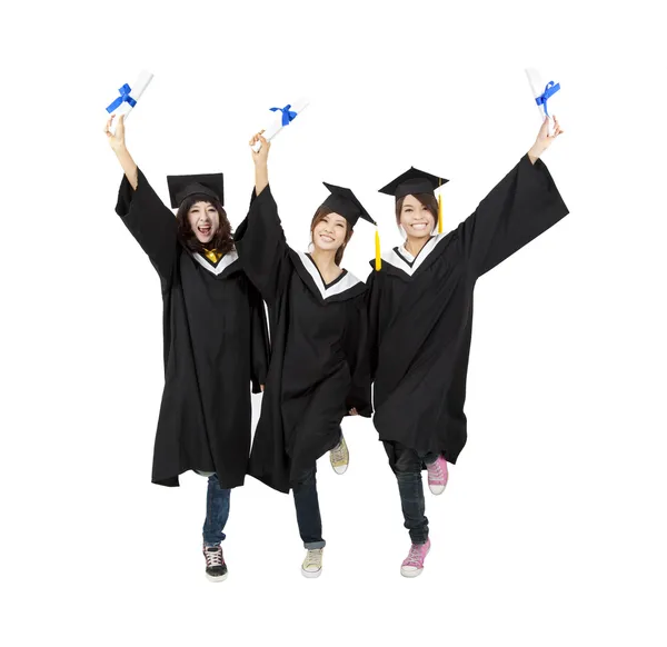 Drie gelukkige Aziatische afstuderen student geïsoleerd op wit — Stockfoto
