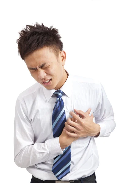 Азиатский молодой бизнесмен с сердечным приступом — стоковое фото