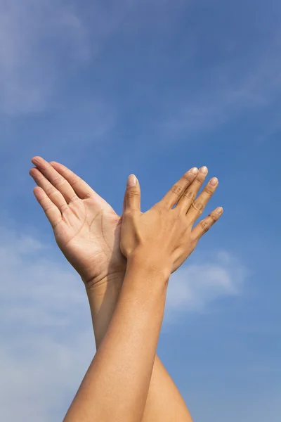Bird hand gesture in the blue sky — Stock Photo, Image