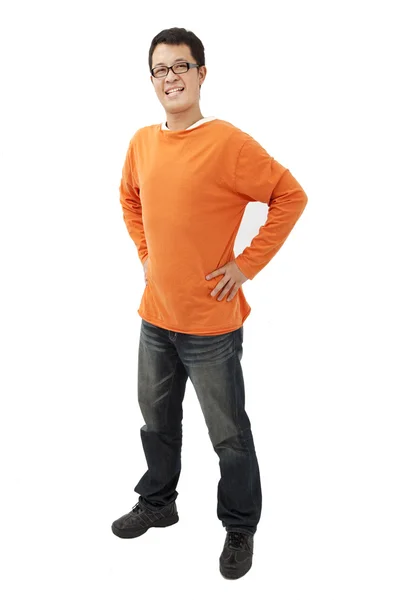 Full length portrait of Asian young man with orange t-shirt — Stock Photo, Image