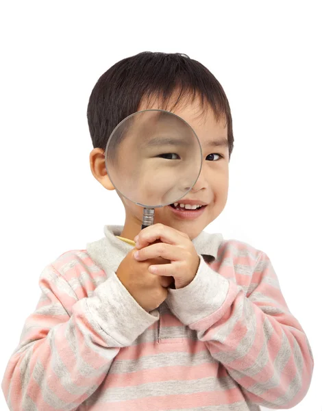 Sonriente niño sosteniendo lupa —  Fotos de Stock