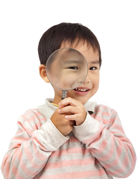 Smiling boy holding magnifier