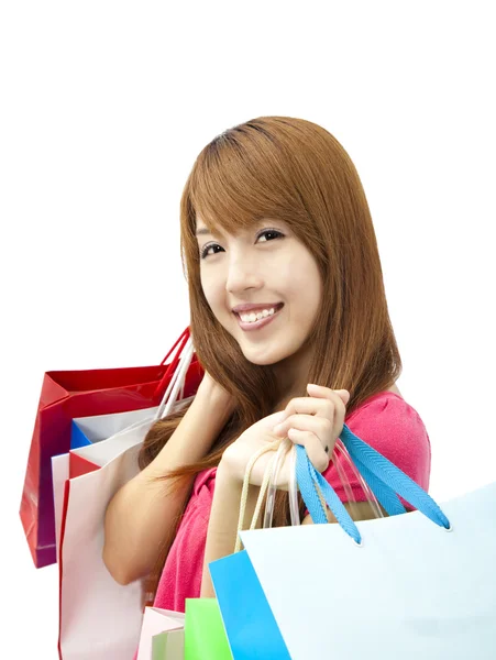 Donna sorridente in possesso di shopping bag isolato su bianco — Foto Stock