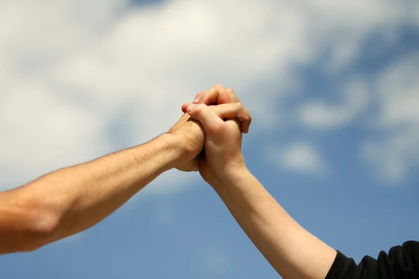 Joining hands with a fist — Stock Photo, Image