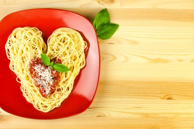 I love Pasta / Spaghetti on a plate and wooden table / Heart Sh clipart