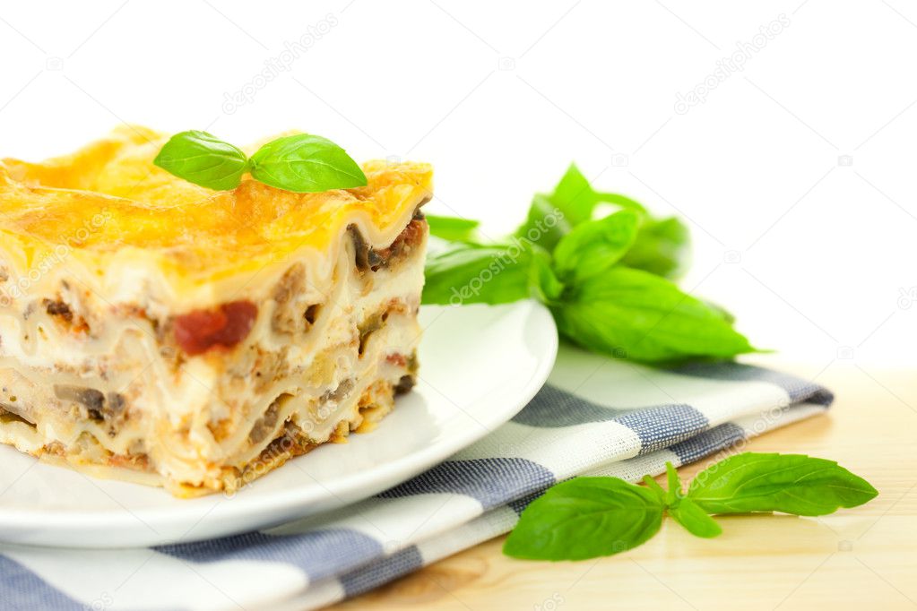Delicious Italian Lasagna / with fresh basil / white background