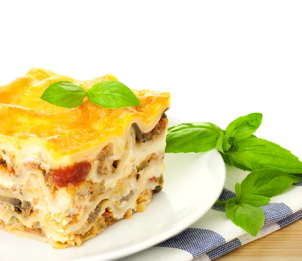 stock image Delicious Italian Lasagna / with fresh basil / white background