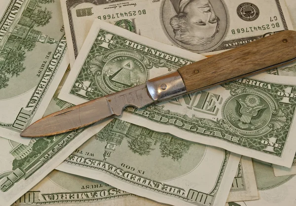 Dagger on dollars — Stock Photo, Image