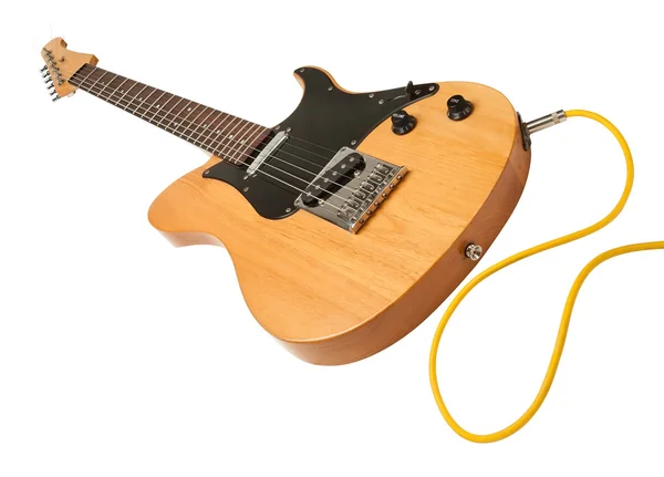 Żółta gitara elektryczna z kablem podłączony — Zdjęcie stockowe