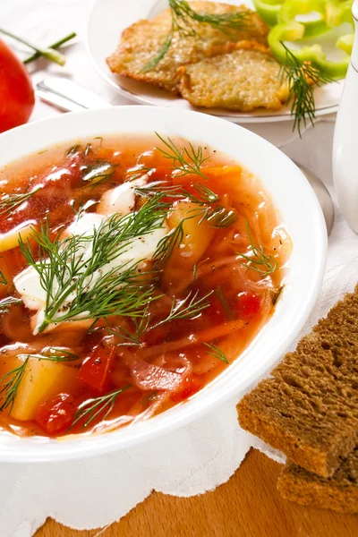 Russian traditional borshch on a table — Stock Photo, Image