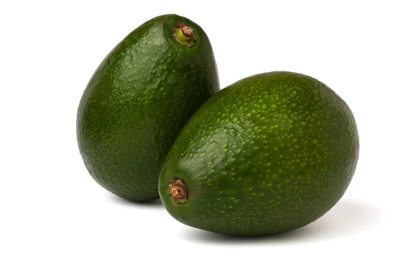 Два авокадо — стоковое фото