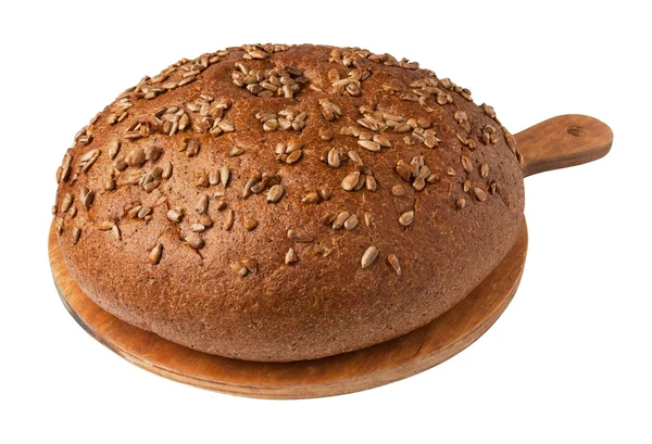 Bochník chleba na desce — Stock fotografie