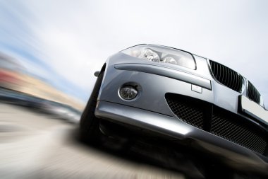 Fast car moving with motion blur clipart