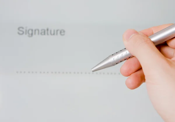 Hand holding pen with document — Stock Photo, Image