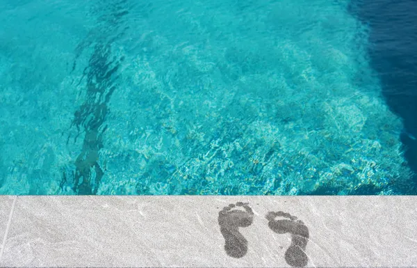 stock image Feet by the swimming pool