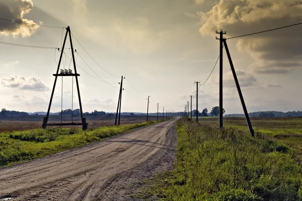 Electricity posts along the road. — Stock Photo, Image