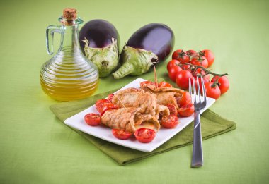 Eggplant roulades with cherry tomato salad. clipart