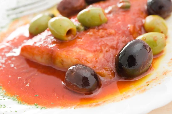 Fish with olives in tomato sauce. — Stock Photo, Image