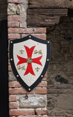 Shield on wall. Grazzano Visconti. Emilia-Romagna. Italy. clipart