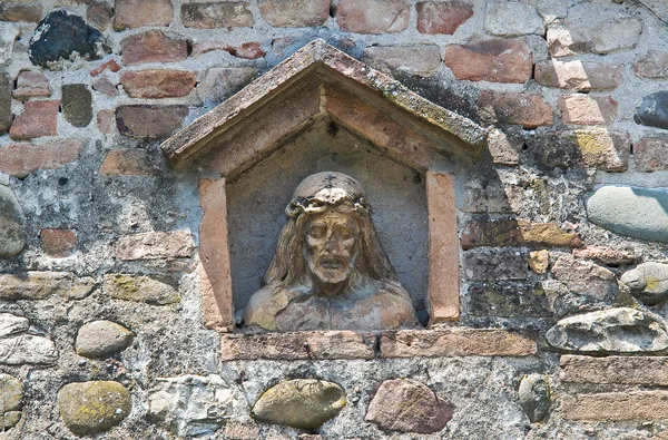 Chrystus w niszy ściany z kamienia. — Zdjęcie stockowe