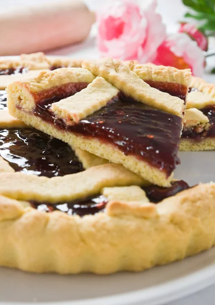 stock image Breakfast with jam tart in white dish.