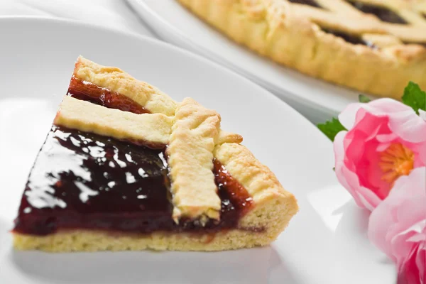 stock image Breakfast with jam tart in white dish.