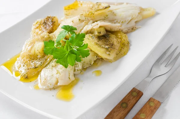 Fish with potatoes. Stock Picture