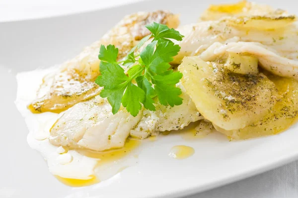 Fish with potatoes. Stock Image