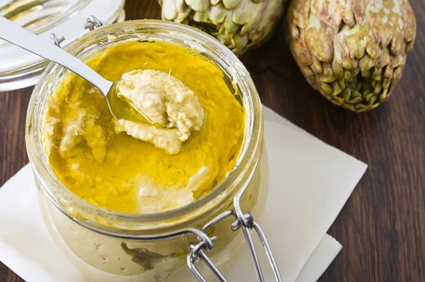 stock image Artichoke pesto in glass jar.