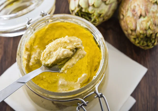 stock image Artichoke pesto in glass jar.