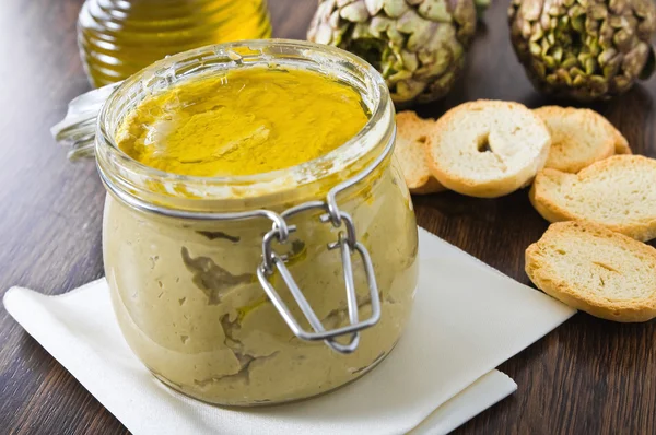 stock image Artichoke pesto in glass jar.