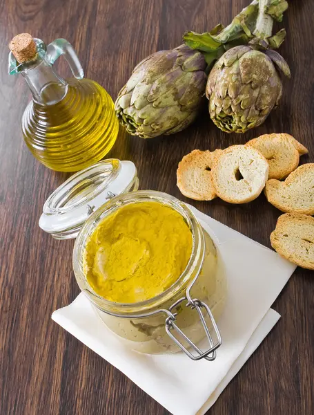 stock image Artichoke pesto in glass jar.