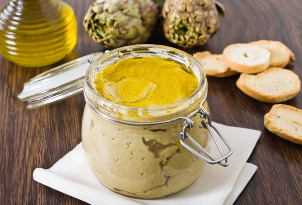 stock image Artichoke pesto in glass jar.