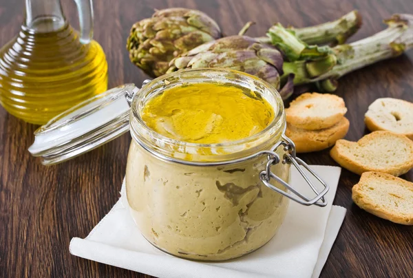 stock image Artichoke pesto in glass jar.