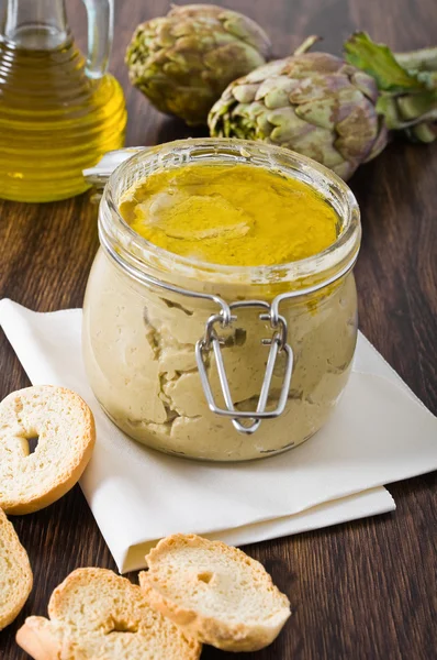 Artichoke pesto in glass jar. — Stock Photo, Image