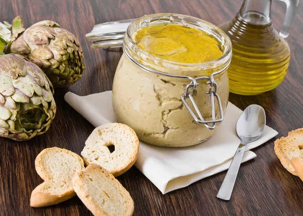 stock image Artichoke pesto in glass jar.