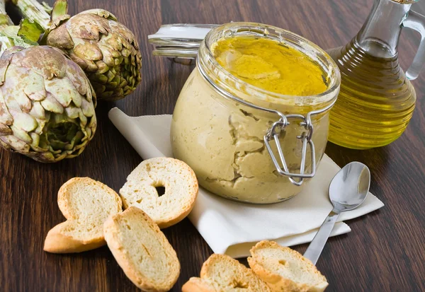 stock image Artichoke pesto in glass jar.