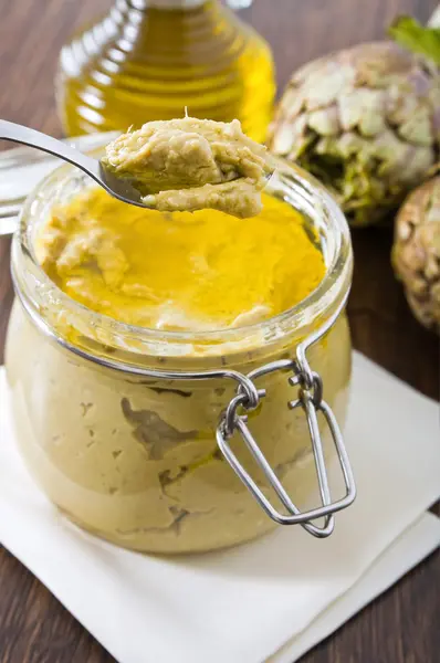 stock image Artichoke pesto in glass jar.