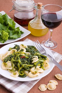 Orecchiette with turnip tops. clipart