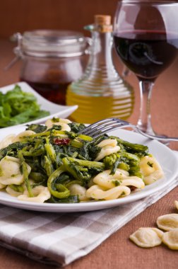 Orecchiette with turnip tops. clipart