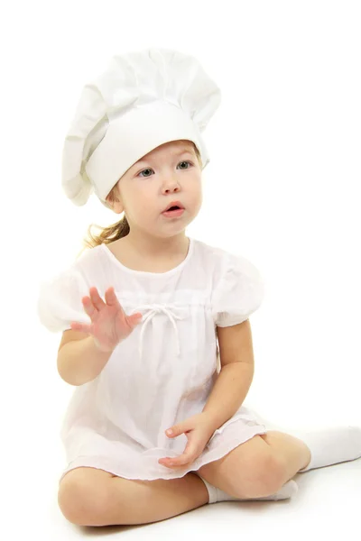 Kislány a szakács kalapban — Stock Fotó