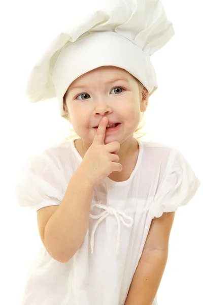 Bébé fille dans le chapeau de cuisine — Photo
