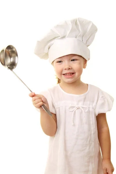Baby flicka i cook hatten Royaltyfria Stockbilder