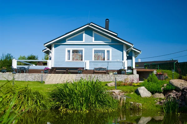 House on lawn — Stock Photo, Image