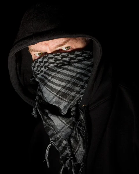 Masked robber wearing hoodie