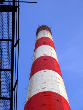 Old red and white industrial chimneys clipart