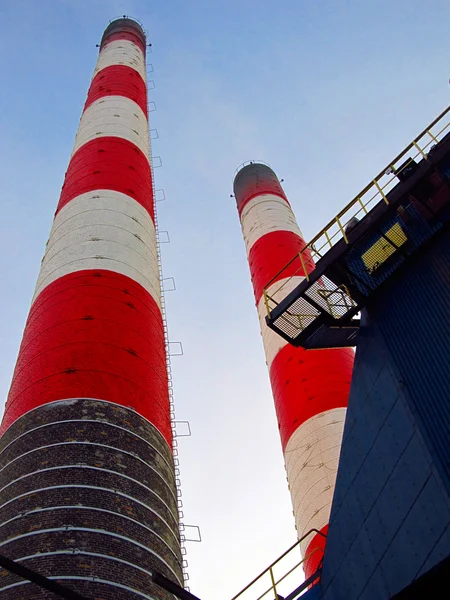 Old red and white industrial chimneys — Stock Photo, Image